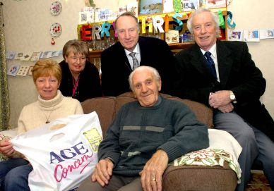 Caring Christmas recipient with representatives of the organisations involved